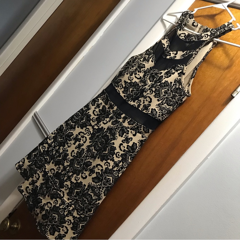 Cute short black appliqué dress.